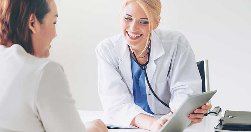 doctor using medical billing services with patient
