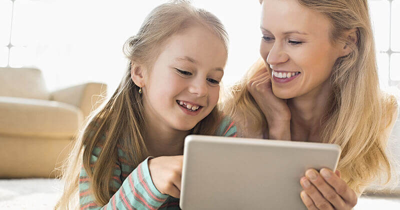 A lady and her daughter connect with doctor via iPad before their visit