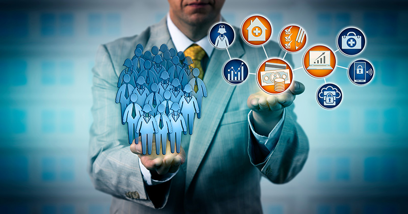 C2 - Man comparing two things in his hands.