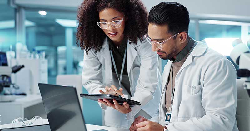 Medical staff holding tablet