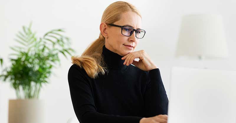 a women watching laptop