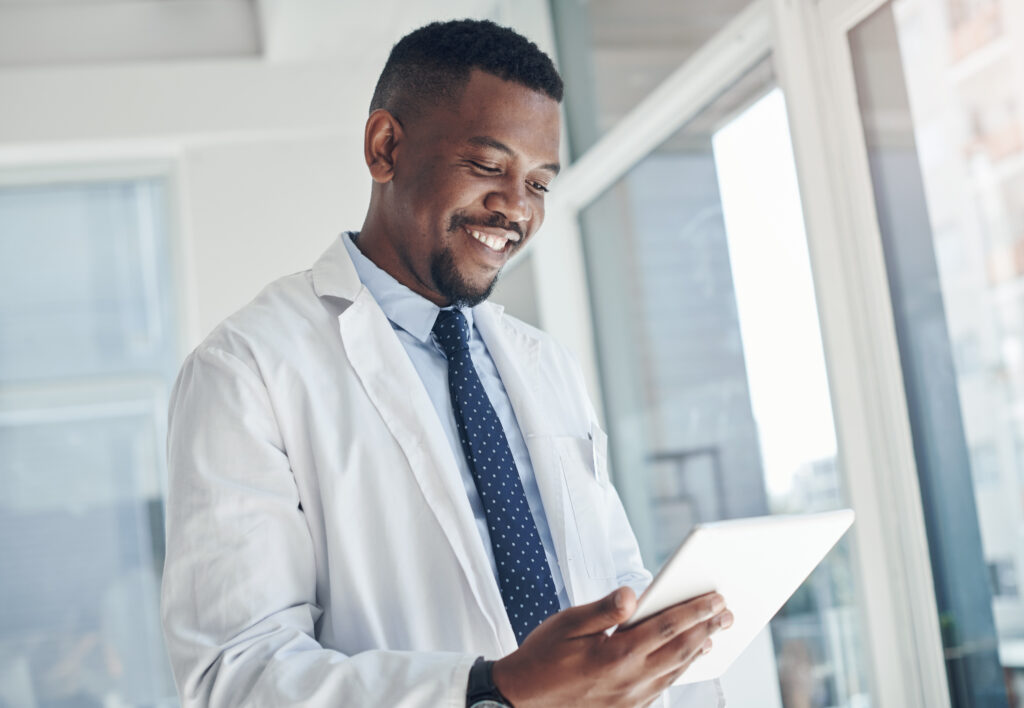 Shot of a young doctor using a digital tablet in an office.