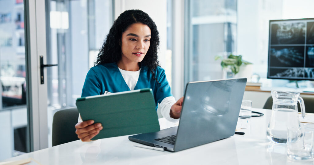 Woman, nurse or research with tablet or laptop for medical study or discovery at hospital. Female person, employee or healthcare worker browsing on technology for telehealth app or results at clinic.
