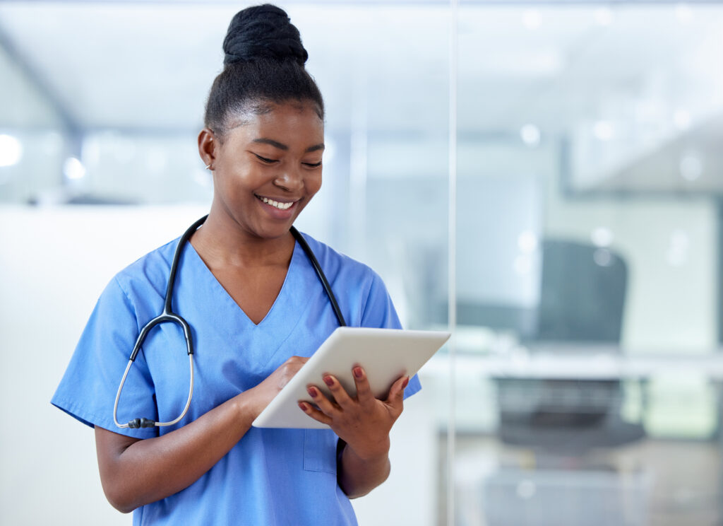 Shot of a young female doctor using a digital tablet at work.