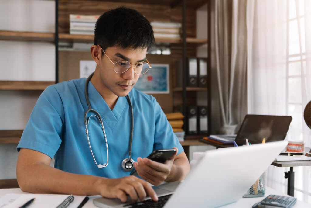 What Patients Expect From Modern Healthcare Apps Medical technology concept. Doctor working with mobile phone and stethoscope in modern office.