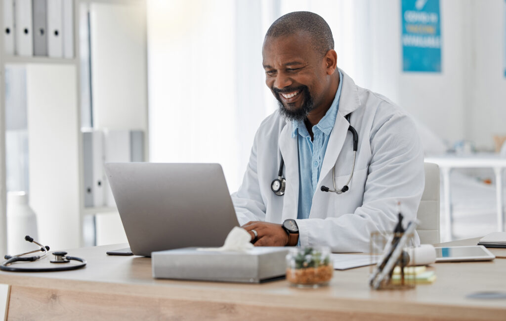 The Challenges Practices Face When Switching EHR Software Doctor, medical and healthcare worker on laptop checking history or medical data at hospital or clinic working with tech. GP man on computer reading emails, patient records and documents.