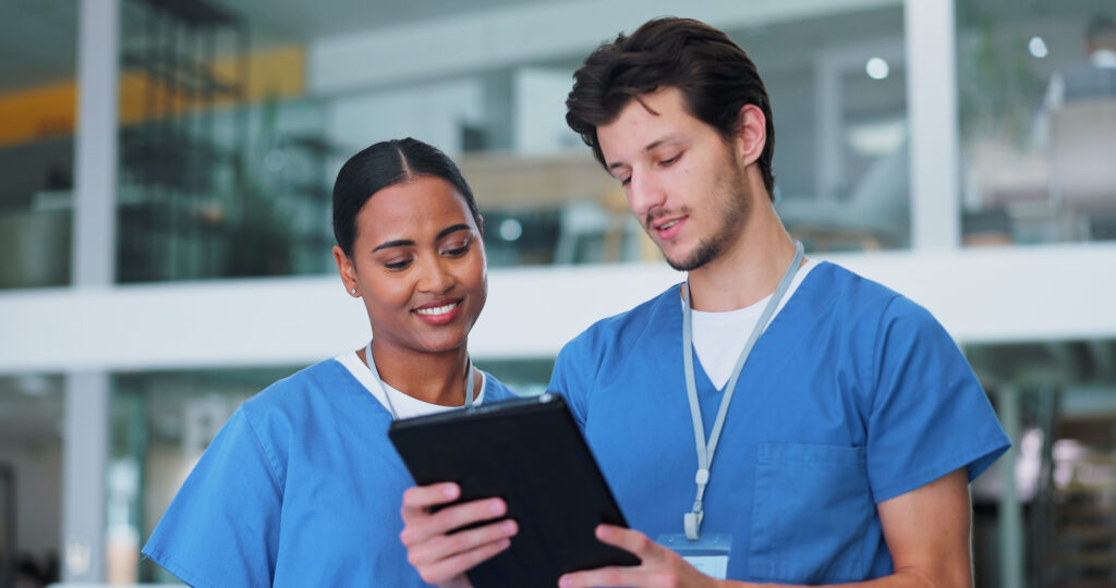 How Practices Can Improve Medical Staff Efficiency Nurses, medical people and man with tablet in meeting for research, planning and support for solution in hospital. Healthcare staff, collaboration or workers with tech, talking or results in clinic.