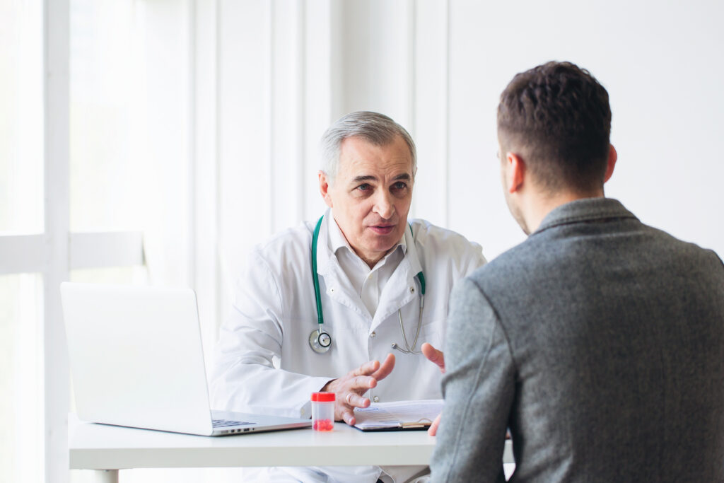 Why Front-End Patient Communication Impacts Operational Efficiency Senior doctor consults young patient
